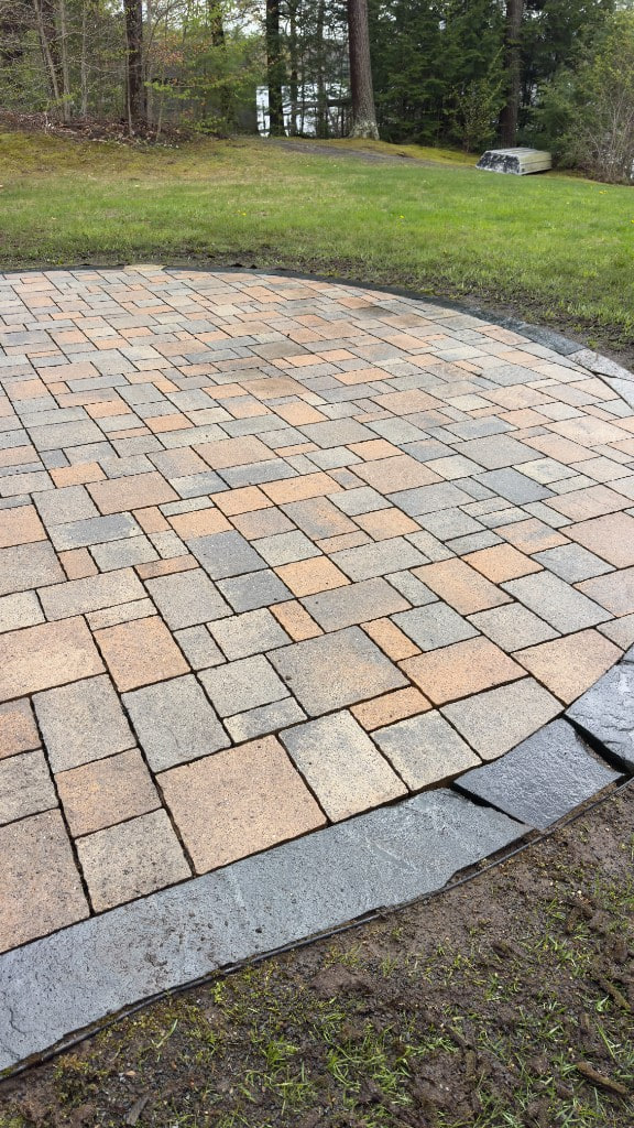 Curved stone paver patio after cleaning