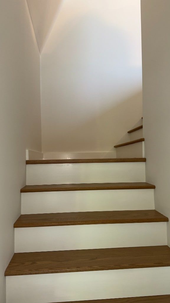 Clean interior corner where painted walls meet the ceiling