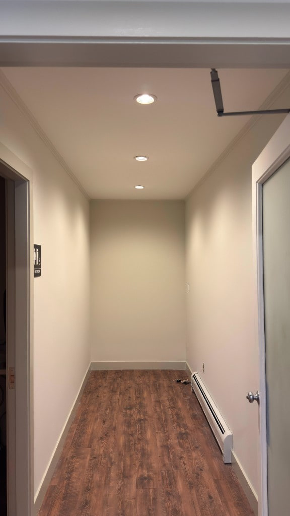 Bright hallway with recessed lights after interior painting