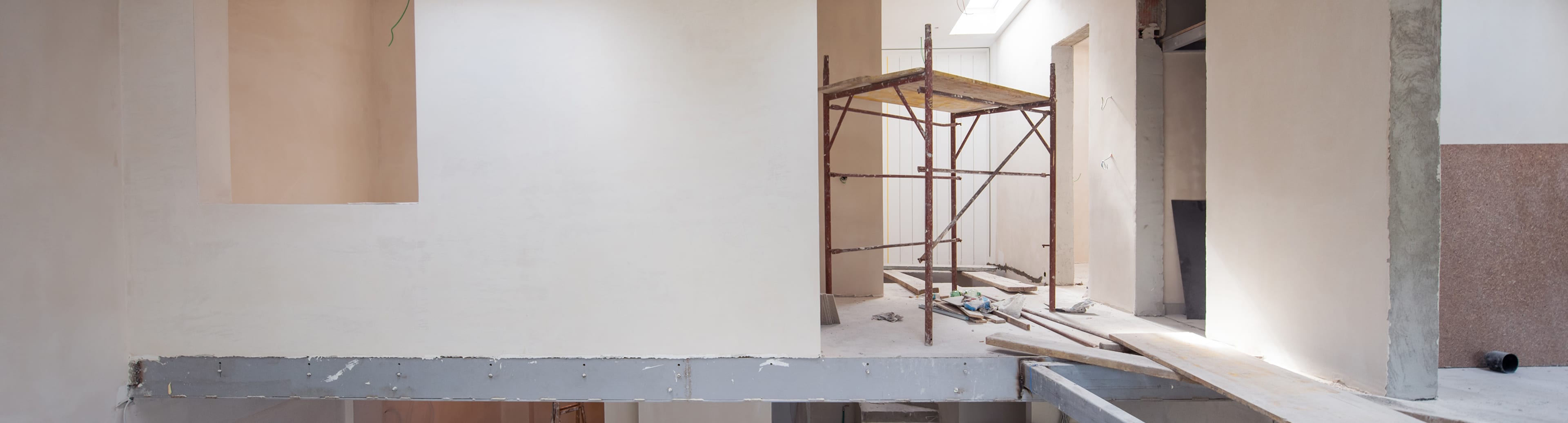 Scaffolding inside a bright unfinished room
