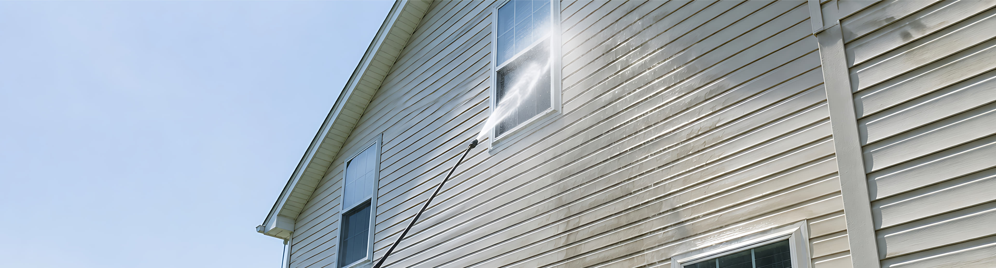 White exterior walls and roof eaves after softwashing