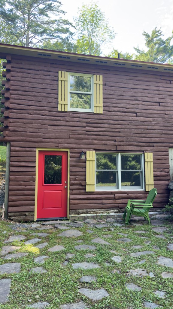Log home after exterior painting by Servidori Painting