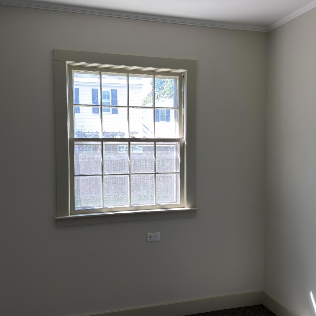 Bedroom corner after repair and painting by Servidori Painting